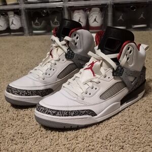 White and Black High-Top Sneakers with Red Accents